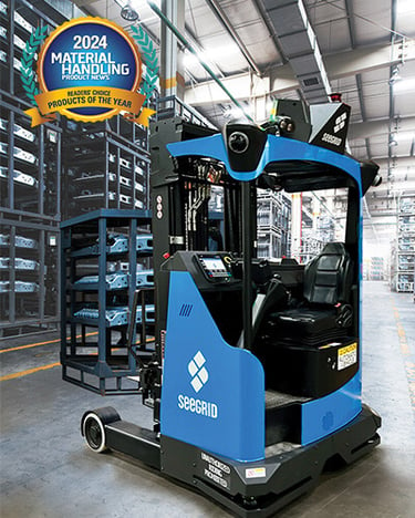 Seegrid Lift CR1 AMR picking and transporting payloads in an automotive manufacturing facility.